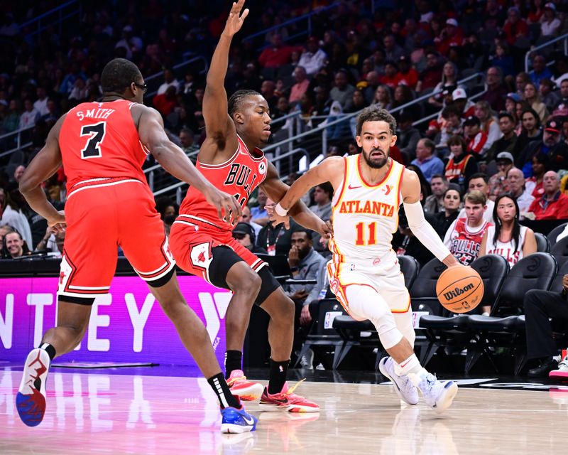 ATLANTA, GA - NOVEMBER 9: Trae Young #11 of the Atlanta Hawks dribbles the ball during the game against the Chicago Bulls on November 9, 2024 at State Farm Arena in Atlanta, Georgia.  NOTE TO USER: User expressly acknowledges and agrees that, by downloading and/or using this Photograph, user is consenting to the terms and conditions of the Getty Images License Agreement. Mandatory Copyright Notice: Copyright 2024 NBAE (Photo by Adam Hagy/NBAE via Getty Images)