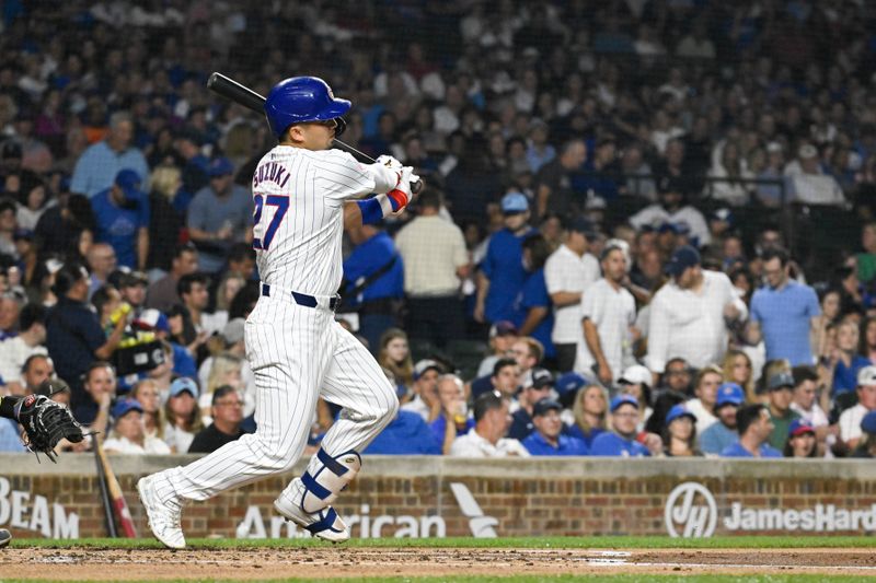 Jul 23, 2024; Chicago, Illinois, USA;  Chicago Cubs outfielder Seiya Suzuki (27) singles during the first inning against the Milwaukee Brewers at Wrigley Field. Mandatory Credit: Matt Marton-USA TODAY Sports