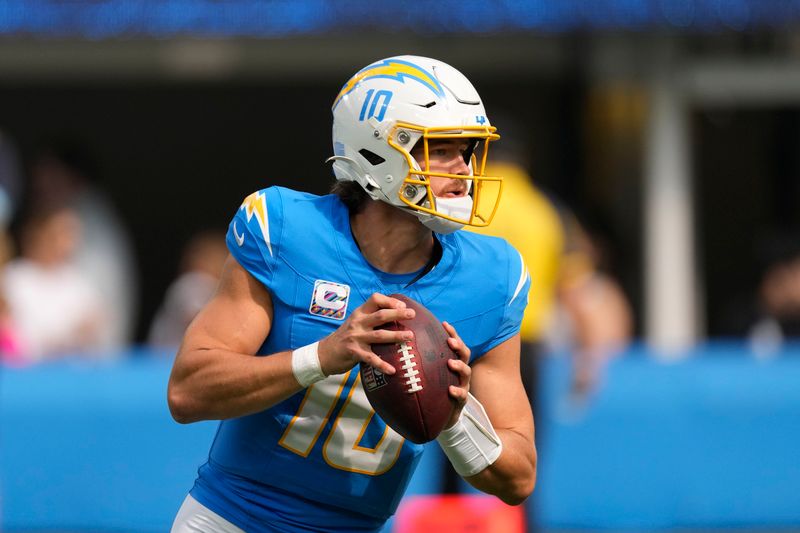 Los Angeles Chargers quarterback Justin Herbert (10) drops back to pass In the first half of an NFL football game against the New Orleans Saints in Inglewood, Calif., Sunday, Oct. 27, 2024. (AP Photo/Mark J. Terrill)