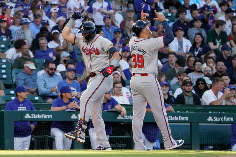 May 22, 2024; Chicago, Illinois, USA; Atlanta Braves outfielder Adam Duvall (14) celebrates his two-run home run with third base coach Matt Tuiasosopo (89) against the Chicago Cubs during the third inning at Wrigley Field. Mandatory Credit: David Banks-USA TODAY Sports