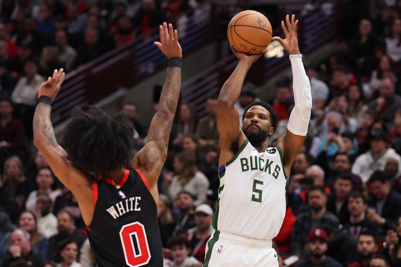 CHICAGO, ILLINOIS - MARCH 01: Malik Beasley #5 of the Milwaukee Bucks shoots a three pointer against Coby White #0 of the Chicago Bulls during the first half at the United Center on March 01, 2024 in Chicago, Illinois. NOTE TO USER: User expressly acknowledges and agrees that, by downloading and or using this photograph, User is consenting to the terms and conditions of the Getty Images License Agreement. (Photo by Michael Reaves/Getty Images)