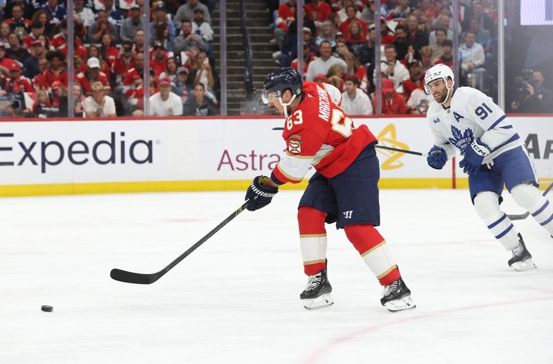 May 11, 2025; Sunrise, Florida, USA; Florida Panthers center Brad Marchand (63) skates with the puck against the Toronto Maple Leafs during the first period in game four of the second round of the 2025 Stanley Cup Playoffs at Amerant Bank Arena. Mandatory Credit: Kim Klement Neitzel-Imagn Images