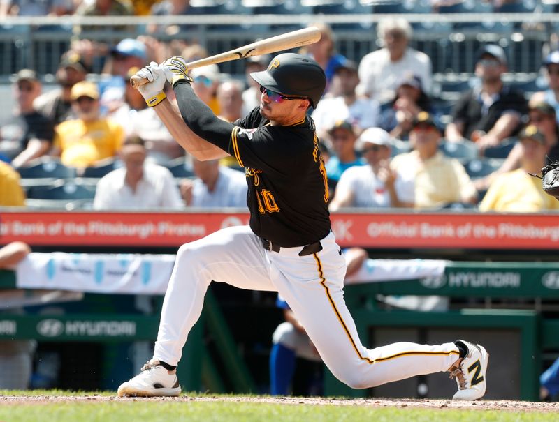 Aug 28, 2024; Pittsburgh, Pennsylvania, USA;  Pittsburgh Pirates shortstop Isiah Kiner-Falefa (7) drives in a run against the Chicago Cubs during the second inning at PNC Park. Mandatory Credit: Charles LeClaire-USA TODAY Sports