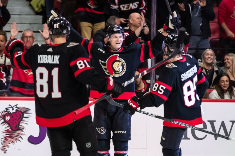 Oct 14, 2023; Ottawa, Ontario, CAN; Ottawa Senators defenseman Jakob Chychrun (6) celebrates with his teammates after his second goal scored in the first period against the Philadelphia Flyers  at the Canadian Tire Centre. Mandatory Credit: Marc DesRosiers-USA TODAY Sports