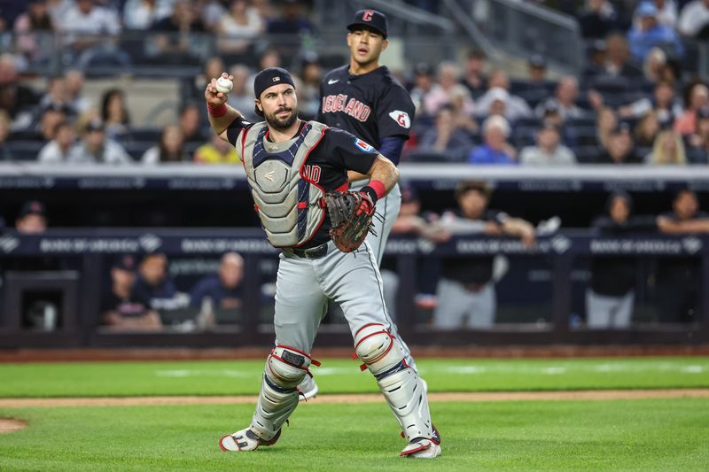 Aug 21, 2024; Bronx, New York, USA;  Cleveland Guardians catcher Austin Hedges (27) throws a runner out at first base in the third inning against the New York Yankees at Yankee Stadium. Mandatory Credit: Wendell Cruz-USA TODAY Sports