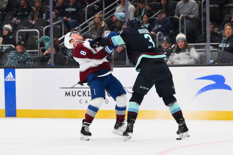 Nov 13, 2023; Seattle, Washington, USA; Colorado Avalanche defenseman Cale Makar (8) is pushed by Seattle Kraken defenseman Will Borgen (3) during the third period at Climate Pledge Arena. Mandatory Credit: Steven Bisig-USA TODAY Sports