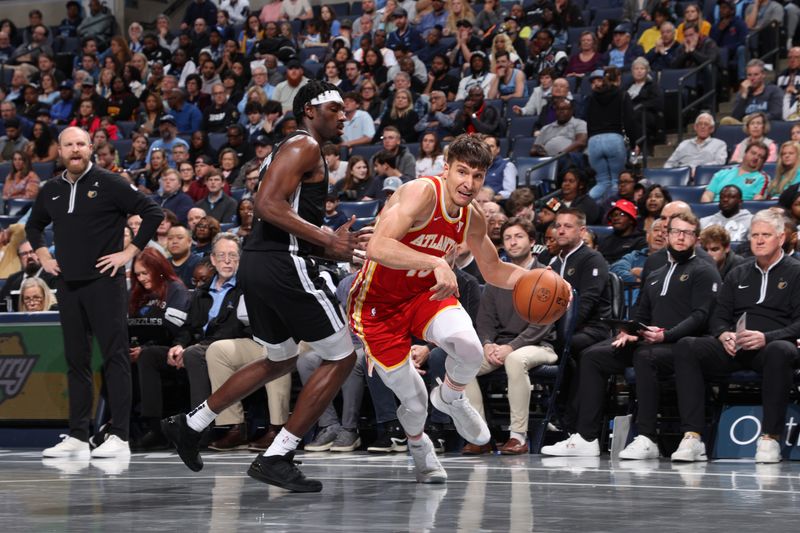 MEMPHIS, TN - MARCH 8: Bogdan Bogdanovic #13 of the Atlanta Hawks drives to the basket during the game against the Memphis Grizzlies on March 8, 2024 at FedExForum in Memphis, Tennessee. NOTE TO USER: User expressly acknowledges and agrees that, by downloading and or using this photograph, User is consenting to the terms and conditions of the Getty Images License Agreement. Mandatory Copyright Notice: Copyright 2024 NBAE (Photo by Joe Murphy/NBAE via Getty Images)