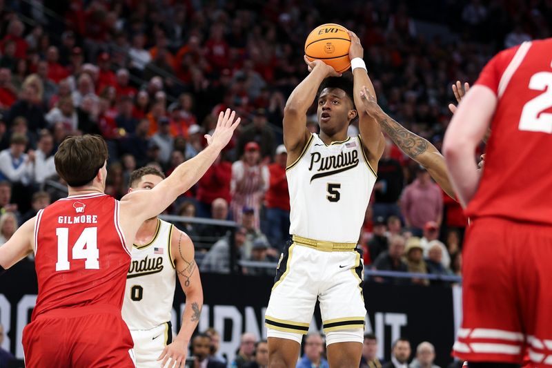 Mar 16, 2024; Minneapolis, MN, USA; Purdue Boilermakers guard Myles Colvin (5) shoots as Wisconsin Badgers forward Carter Gilmore (14) defends during the first half at Target Center. Mandatory Credit: Matt Krohn-USA TODAY Sports