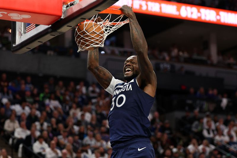 MINNEAPOLIS, MINNESOTA - OCTOBER 26: Julius Randle #30 of the Minnesota Timberwolves dunks the ball against the Toronto Raptors in the second quarter of the home opener at Target Center on October 26, 2024 in Minneapolis, Minnesota. NOTE TO USER: User expressly acknowledges and agrees that, by downloading and or using this photograph, User is consenting to the terms and conditions of the Getty Images License Agreement (Photo by David Berding/Getty Images)