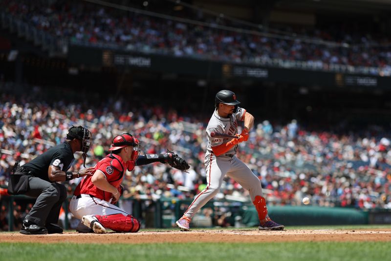 May 25, 2025; Washington, District of Columbia, USA; San Francisco Giants shortstop Willy Adames (2) hits a groundout RBI against the Washington Nationals during the second inning at Nationals Park. Mandatory Credit: Geoff Burke-Imagn Images