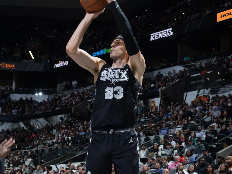 SAN ANTONIO, TX - NOVEMBER 19: Zach Collins #23 of the San Antonio Spurs shoots a three point basket during the game against the Oklahoma City Thunder during the Emirates NBA Cup game on November 19, 2024 at the Frost Bank Center in San Antonio, Texas. NOTE TO USER: User expressly acknowledges and agrees that, by downloading and or using this photograph, user is consenting to the terms and conditions of the Getty Images License Agreement. Mandatory Copyright Notice: Copyright 2024 NBAE (Photos by Michael Gonzales/NBAE via Getty Images)