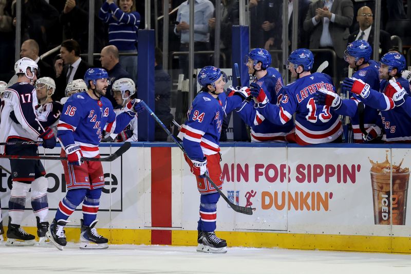 Mar 2, 2026; New York, New York, USA; New York Rangers right wing Gabe Perreault (94) celebrates his goal against the Columbus Blue Jackets with teammates during the third period at Madison Square Garden. Mandatory Credit: Brad Penner-Imagn Images