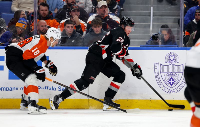 Dec 18, 2025; Buffalo, New York, USA;  Buffalo Sabres defenseman Rasmus Dahlin (26) controls the puck as Philadelphia Flyers center Rodrigo Abols (18) defends during the second period at KeyBank Center. Mandatory Credit: Timothy T. Ludwig-Imagn Images