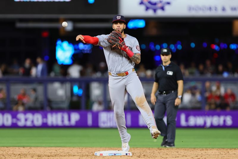 Apr 26, 2024; Miami, Florida, USA; Washington Nationals second baseman Luis Garcia Jr. (2) throws to first base to retire Miami Marlins shortstop Tim Anderson (not pictured) during the ninth inning at loanDepot Park. Mandatory Credit: Sam Navarro-USA TODAY Sports