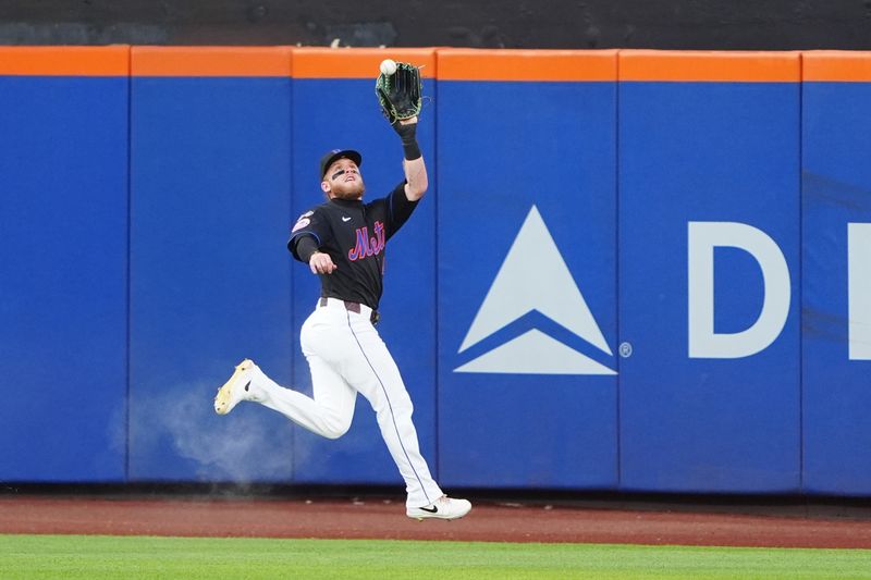 Jul 10, 2024; New York City, New York, USA; New York Mets center fielder Harrison Bader (44) catches a fly ball hit by Washington Nationals shortstop CJ Abrams (not pictured) during the first inning at Citi Field. Mandatory Credit: Gregory Fisher-USA TODAY Sports