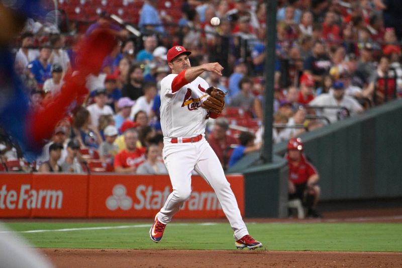 Jul 27, 2023; St. Louis, Missouri, USA; St. Louis Cardinals third baseman Nolan Arenado (28) throws to first for an out against the Chicago Cubs in the fifth inning at Busch Stadium. Mandatory Credit: Joe Puetz-USA TODAY Sports