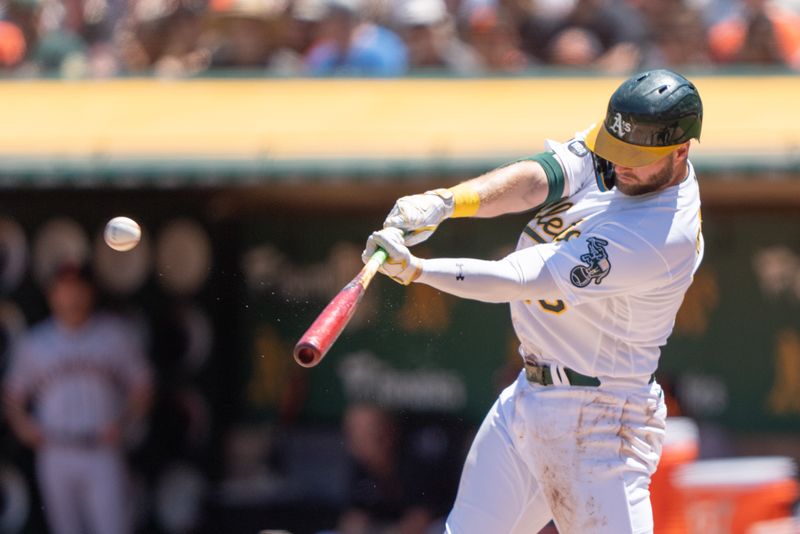 Aug 6, 2023; Oakland, California, USA;  Oakland Athletics left fielder Seth Brown (15) hits an RBI triple during the first inning against the San Francisco Giants at Oakland-Alameda County Coliseum. Mandatory Credit: Stan Szeto-USA TODAY Sports