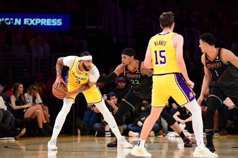 LOS ANGELES, CA - FEBRUARY 29: Anthony Davis #3 of the Los Angeles Lakers looks to pass the ball during the game against the Washington Wizards on February 29, 2024 at Crypto.Com Arena in Los Angeles, California. NOTE TO USER: User expressly acknowledges and agrees that, by downloading and/or using this Photograph, user is consenting to the terms and conditions of the Getty Images License Agreement. Mandatory Copyright Notice: Copyright 2024 NBAE (Photo by Adam Pantozzi/NBAE via Getty Images)