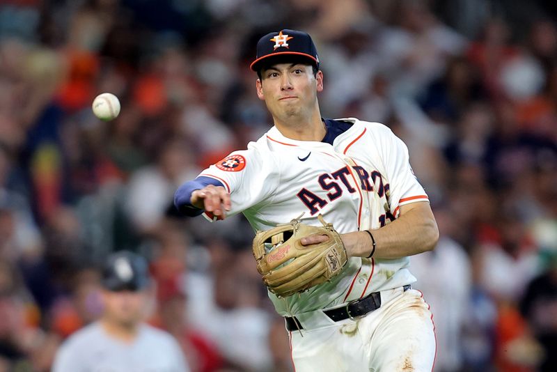 Aug 18, 2024; Houston, Texas, USA; Houston Astros third baseman Shay Whitcomb (10) throws a fielded ball to first base for an out against the Chicago White Sox during the sixth inning at Minute Maid Park. Mandatory Credit: Erik Williams-USA TODAY Sports