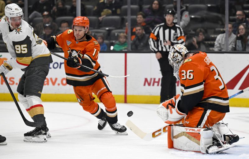 Dec 4, 2024; Anaheim, California, USA;  Anaheim Ducks goaltender John Gibson (36) deflects a shot by Vegas Golden Knights right wing Victor Olofsson (95) with center Trevor Zegras (11) defending during the first period at Honda Center. Mandatory Credit: Alex Gallardo-Imagn Images