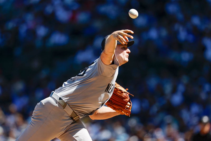 Sep 7, 2024; Chicago, Illinois, USA; New York Yankees starting pitcher Clarke Schmidt (36) delivers a pitch against the Chicago Cubs during the first inning at Wrigley Field. Mandatory Credit: Kamil Krzaczynski-Imagn Images