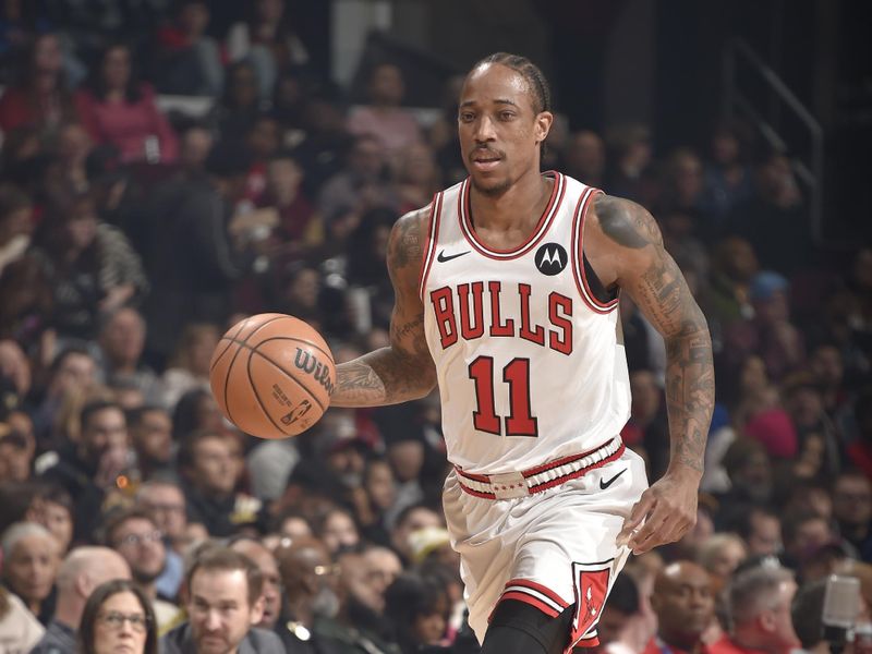 CLEVELAND, OH - FEBRUARY 14: DeMar DeRozan #11 of the Chicago Bulls dribbles the ball during the game against the Cleveland Cavaliers on February 14, 2024 at Rocket Mortgage FieldHouse in Cleveland, Ohio. NOTE TO USER: User expressly acknowledges and agrees that, by downloading and/or using this Photograph, user is consenting to the terms and conditions of the Getty Images License Agreement. Mandatory Copyright Notice: Copyright 2024 NBAE (Photo by David Liam Kyle/NBAE via Getty Images)