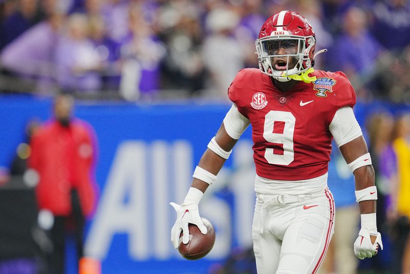 Dec 31, 2022; New Orleans, LA, USA; Alabama Crimson Tide defensive back Jordan Battle (9) celebrates his interception against the Kansas State Wildcats during the first half in the 2022 Sugar Bowl at Caesars Superdome. Mandatory Credit: Andrew Wevers-USA TODAY Sports