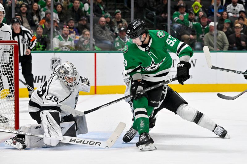 Jan 16, 2024; Dallas, Texas, USA; Los Angeles Kings goaltender Cam Talbot (39) stops a backhand shot by Dallas Stars center Wyatt Johnston (53) during the second period at the American Airlines Center. Mandatory Credit: Jerome Miron-USA TODAY Sports