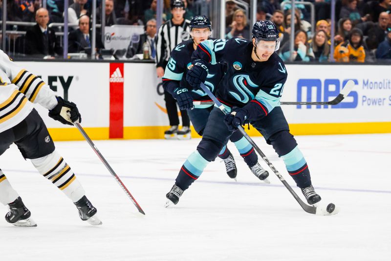 Feb 26, 2024; Seattle, Washington, USA; Seattle Kraken right wing Eeli Tolvanen (20) skates with the puck against the Boston Bruins during the first period at Climate Pledge Arena. Mandatory Credit: Joe Nicholson-USA TODAY Sports