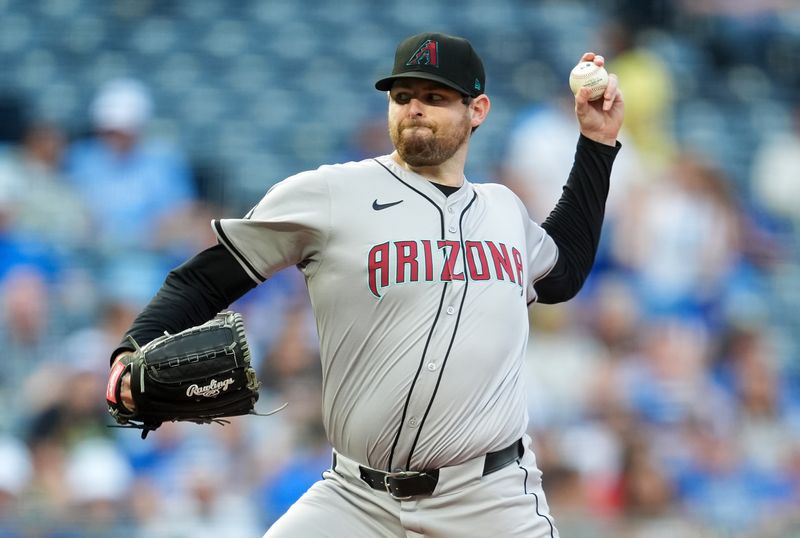 Jul 23, 2024; Kansas City, Missouri, USA; Arizona Diamondbacks starting pitcher Jordan Montgomery (52) pitches during the first inning against the Kansas City Royals at Kauffman Stadium. Mandatory Credit: Jay Biggerstaff-USA TODAY Sports