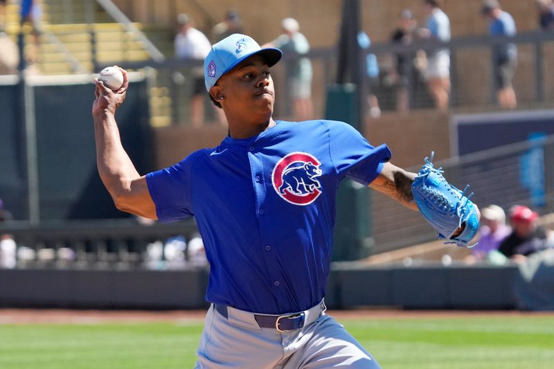 Mar 21, 2024; Salt River Pima-Maricopa, Arizona, USA; Chicago Cubs relief pitcher Yency Almonte (25) pitches against the Colorado Rockies in the first inning at Salt River Fields at Talking Stick. Mandatory Credit: Rick Scuteri-USA TODAY Sports