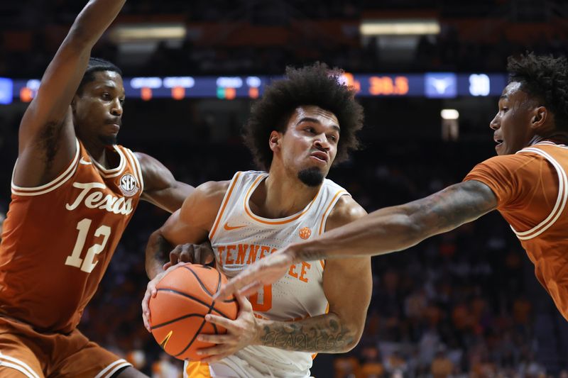 Jan 6, 2026; Knoxville, Tennessee, USA;  Tennessee Volunteers guard Ja'kobi Gillespie (0) moves the ball against the Texas Longhorns during the first half at Thompson-Boling Arena at Food City Center. Mandatory Credit: Randy Sartin-Imagn Images