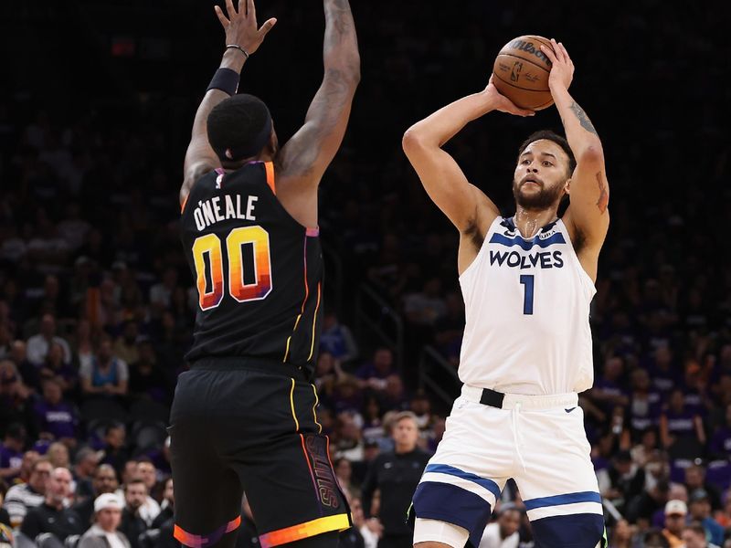 PHOENIX, ARIZONA - APRIL 28: Kyle Anderson #1 of the Minnesota Timberwolves looks to pass against Royce O'Neale #00 of the Phoenix Suns during the first half of game four of the Western Conference First Round Playoffs at Footprint Center on April 28, 2024 in Phoenix, Arizona. NOTE TO USER: User expressly acknowledges and agrees that, by downloading and or using this photograph, User is consenting to the terms and conditions of the Getty Images License Agreement.  (Photo by Christian Petersen/Getty Images)