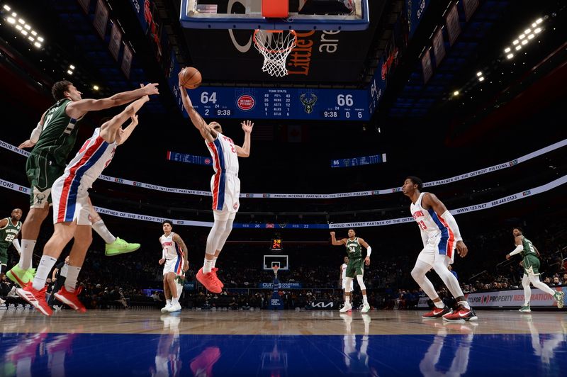 DETROIT, MI - JANUARY 22: Kevin Knox II #24 of the Detroit Pistons grabs a rebound during the game against the Milwaukee Bucks on January 22, 2024 at Little Caesars Arena in Detroit, Michigan. NOTE TO USER: User expressly acknowledges and agrees that, by downloading and/or using this photograph, User is consenting to the terms and conditions of the Getty Images License Agreement. Mandatory Copyright Notice: Copyright 2024 NBAE (Photo by Chris Schwegler/NBAE via Getty Images)