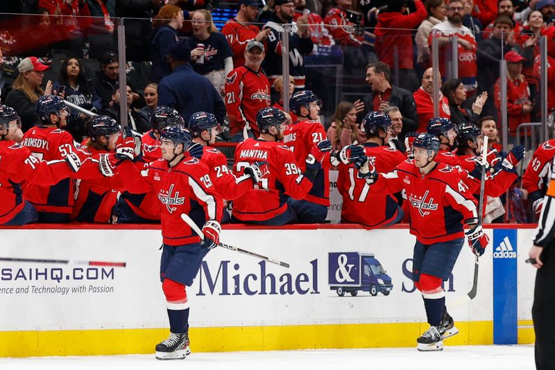 Feb 26, 2024; Washington, District of Columbia, USA; Washington Capitals center Hendrix Lapierre (29) celebrates with teammates after scoring a goal against the Ottawa Senators in the second period at Capital One Arena. Mandatory Credit: Geoff Burke-USA TODAY Sports