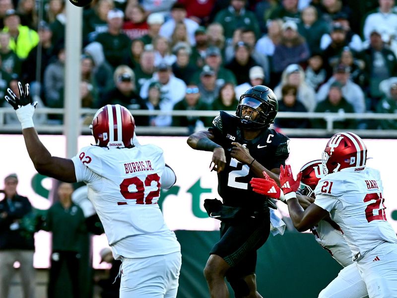 Nov 2, 2024; East Lansing, Michigan, USA;  Michigan State Spartans quarterback Aidan Chiles (2) throws the football into the sidelines in this third quarter play that he was injured in against the Indiana Hoosiers at Spartan Stadium. Chiles never returned to the game. Mandatory Credit: Dale Young-Imagn Images