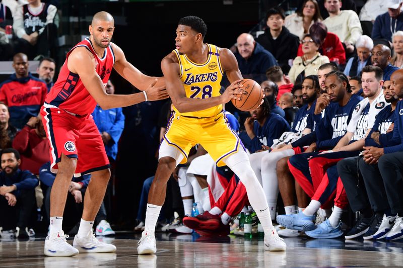 INGLEWOOD, CA - FEBRUARY 4:  Rui Hachimura #28 of the Los Angeles Lakers looks to pass the ball during the game against the LA Clippers on February 4, 2025 at Intuit Dome in Los Angeles, California. NOTE TO USER: User expressly acknowledges and agrees that, by downloading and/or using this Photograph, user is consenting to the terms and conditions of the Getty Images License Agreement. Mandatory Copyright Notice: Copyright 2025 NBAE (Photo by Adam Pantozzi/NBAE via Getty Images)