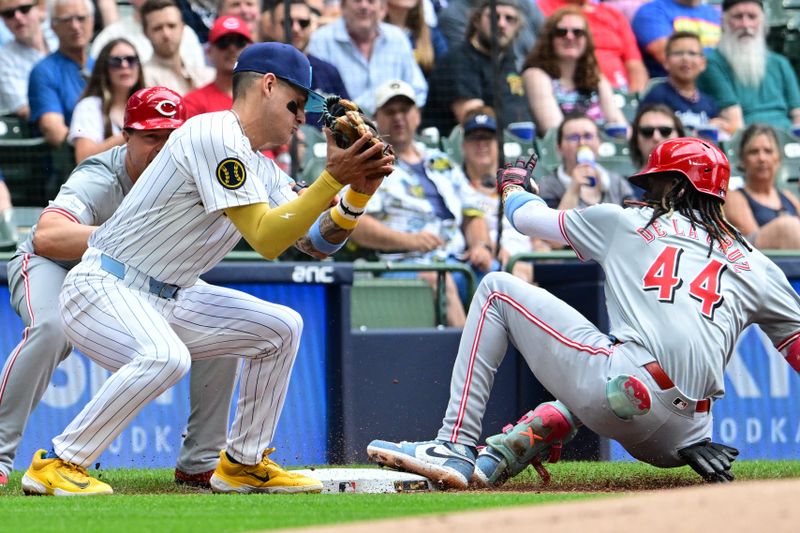 Jun 16, 2024; Milwaukee, Wisconsin, USA; Cincinnati Reds shortstop Elly De La Cruz (44) slides into third base before tag by Milwaukee Brewers  third baseman Joey Ortiz (3)  for a triple in the first inning at American Family Field. Mandatory Credit: Benny Sieu-USA TODAY Sports