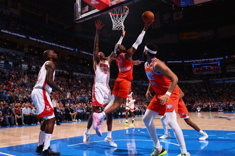 OKLAHOMA CITY, OK - FEBRUARY 27: Shai Gilgeous-Alexander #2 of the Oklahoma City Thunder drives to the basket during the game against the Houston Rockets on February, 2024 at Paycom Arena in Oklahoma City, Oklahoma. NOTE TO USER: User expressly acknowledges and agrees that, by downloading and or using this photograph, User is consenting to the terms and conditions of the Getty Images License Agreement. Mandatory Copyright Notice: Copyright 2024 NBAE (Photo by Zach Beeker/NBAE via Getty Images)