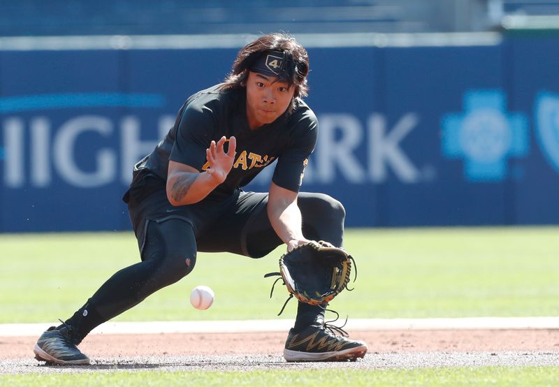 Apr 12, 2023; Pittsburgh, Pennsylvania, USA;  Pittsburgh Pirates second baseman Ji Hwan Bae (3) takes ground balls before the game against the Houston Astros at PNC Park. Mandatory Credit: Charles LeClaire-USA TODAY Sports