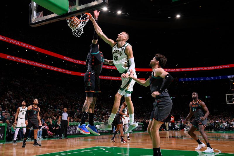 BOSTON, MA - FEBRUARY 9: Kristaps Porzingis #8 of the Boston Celtics dunks the bal during the game against the Washington Wizards on February 9, 2024 at the TD Garden in Boston, Massachusetts. NOTE TO USER: User expressly acknowledges and agrees that, by downloading and or using this photograph, User is consenting to the terms and conditions of the Getty Images License Agreement. Mandatory Copyright Notice: Copyright 2024 NBAE  (Photo by Brian Babineau/NBAE via Getty Images)