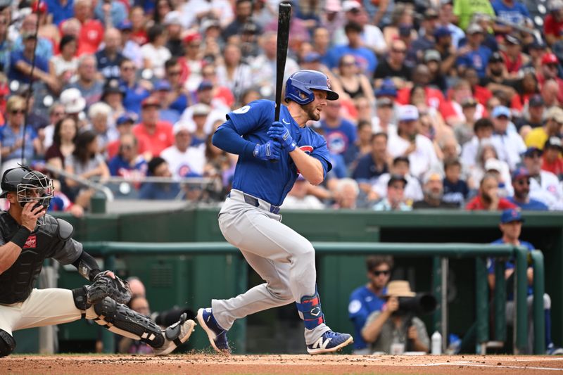 Aug 31, 2024; Washington, District of Columbia, USA; Chicago Cubs first baseman Michael Busch (29) watches the ball after he hit it into play against the Washington Nationals during the second inning at Nationals Park. Mandatory Credit: Rafael Suanes-USA TODAY Sports