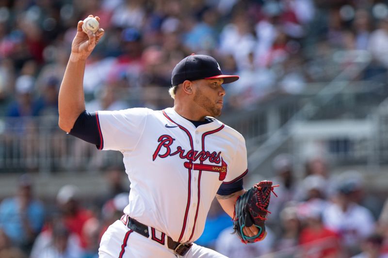 Sep 8, 2024; Cumberland, Georgia, USA; Atlanta Braves pitcher Joe Jimenez (77) pitches the ball against the Toronto Blue Jays during the eighth inning at Truist Park. Mandatory Credit: Jordan Godfree-Imagn Images