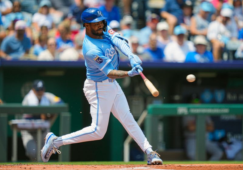Jul 30, 2025; Kansas City, Missouri, USA; Kansas City Royals third baseman Maikel Garcia (11) hits a single during the first inning against the Atlanta Braves at Kauffman Stadium. Mandatory Credit: Jay Biggerstaff-Imagn Images