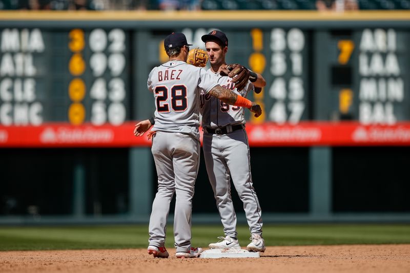 Jul 2, 2023; Denver, Colorado, USA; Detroit Tigers shortstop Javier Baez (28) and third baseman Zack Short (59) celebrate after the game against the Colorado Rockies at Coors Field. Mandatory Credit: Isaiah J. Downing-USA TODAY Sports