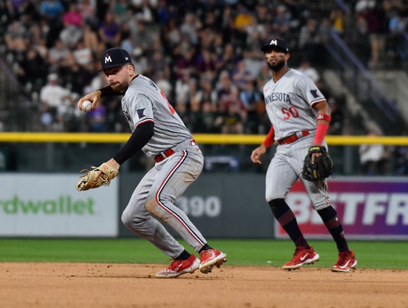 Sep 30, 2023; Denver, Colorado, USA; Minnesota Twins second baseman Edouard Julien (47) prepares to throw ti first base to get Colorado Rockies right fielder Charlie Blackmon for the out in the fifth inning at Coors Field. Mandatory Credit: John Leyba-USA TODAY Sports