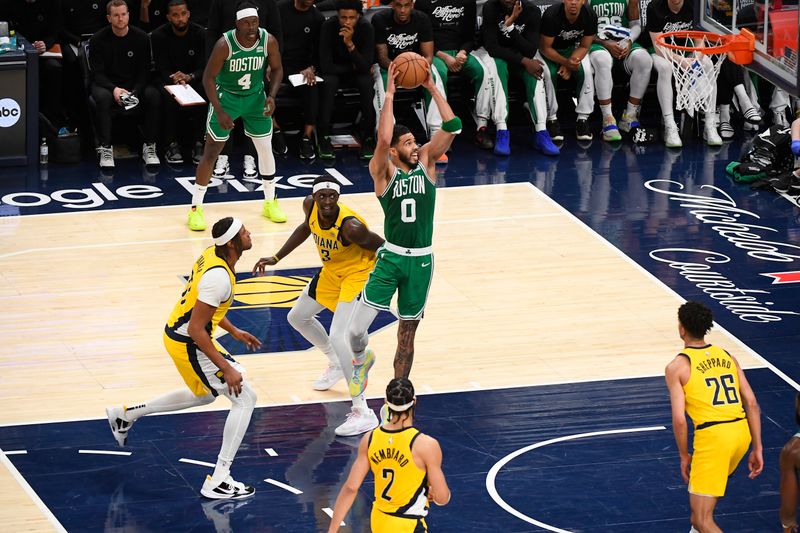 INDIANAPOLIS, IN - MAY 27:  Jayson Tatum #0 of the Boston Celtics slam dunk the ball during the game  against the Indiana Pacers  during Game 4 of the Eastern Conference Finals of the 2024 NBA Playoffs on May 27, 2024 at Gainbridge Fieldhouse in Indianapolis, Indiana. NOTE TO USER: User expressly acknowledges and agrees that, by downloading and or using this Photograph, user is consenting to the terms and conditions of the Getty Images License Agreement. Mandatory Copyright Notice: Copyright 2024 NBAE (Photo by Brian Babineau/NBAE via Getty Images)