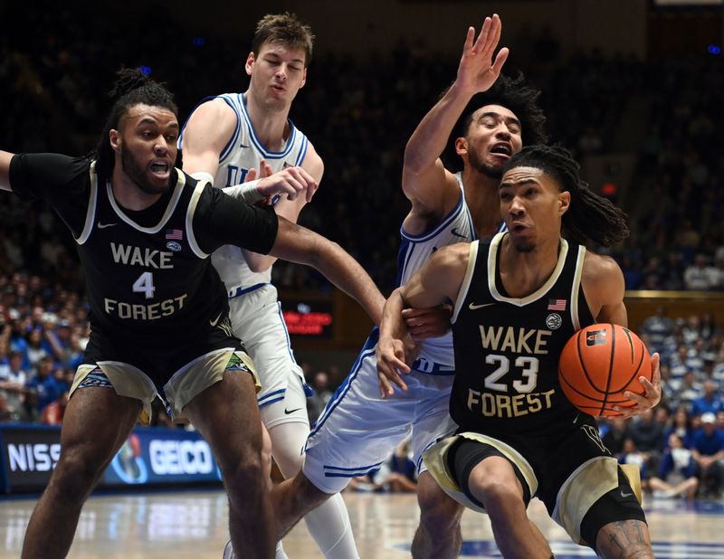 Feb 12, 2024; Durham, North Carolina, USA;  Wake Forest Deamon Deacons guard Hunter Sallis (23) drives to the basket as Duke Blue Devils guard Jared McCain (0) defends during the first half at Cameron Indoor Stadium. Mandatory Credit: Rob Kinnan-USA TODAY Sports