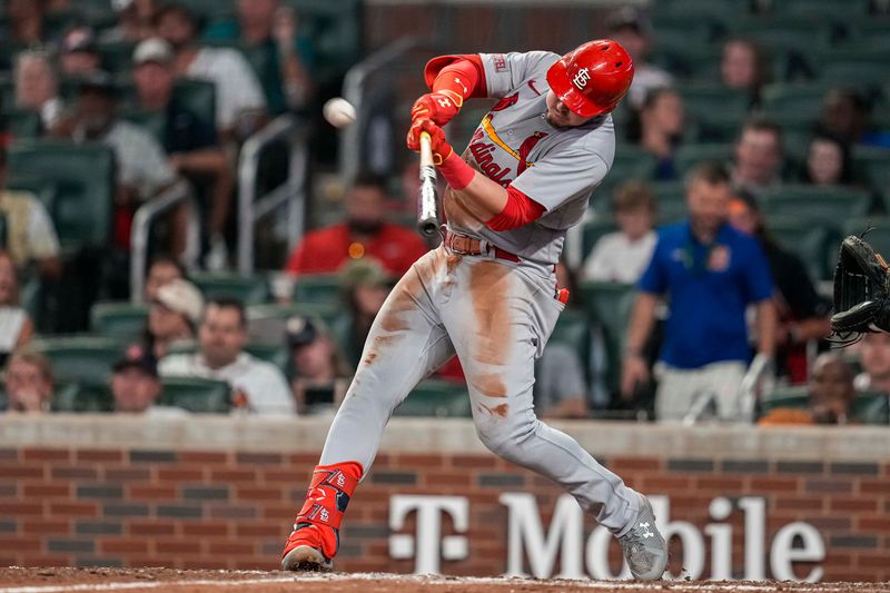 Sep 6, 2023; Cumberland, Georgia, USA; St. Louis Cardinals second baseman Nolan Gorman (16) hits a three run home run against the Atlanta Braves during the eighth inning at Truist Park. Mandatory Credit: Dale Zanine-USA TODAY Sports