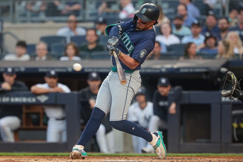 May 21, 2024; Bronx, New York, USA; Seattle Mariners third baseman Josh Rojas (4) doubles during the third inning against the New York Yankees at Yankee Stadium. Mandatory Credit: Vincent Carchietta-USA TODAY Sports